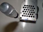 Remove 2 Metal Housing Screws Using Torx T7 or Philips head Screwdriver.